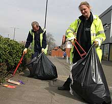 Photo of staff picking litter