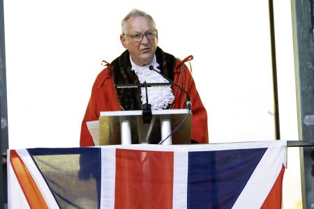 Lord Mayor dressed in his red robes and chains reads the proclamation from the balcony at the Civic Centre.