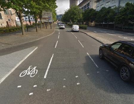 Advisory cycle track, with bicycle marked on the highway with intermitted white lines