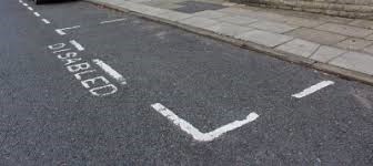 Advisory disabled bay, with the word ‘disabled’ marked on highway