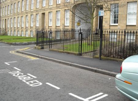 On street disabled bay, ‘Disabled’ marked on highway and a sign adjacent to the bay