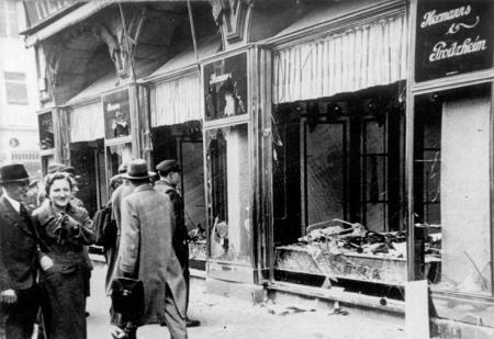 Broken shop windows and glass in the streets following Kristallnacht