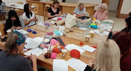 group of women crocheting
