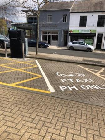 Electric charging bay for Private Hire E-Taxi Bay marked with white lines and picture of vehicle charing in centre of the bay, wording in the pay states ‘E Taxi PH only’