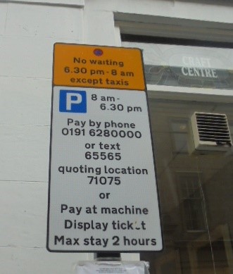 The shared use sign in use for taxis and pay and display users, the first part of the sign is yellow with a no waiting symbol and states ‘No waiting 6.30pm – 8am except taxis’. Underneath is the sign which advises payment can be made by pay by phone or at the machine and that there is a maximum stay of 2 hours