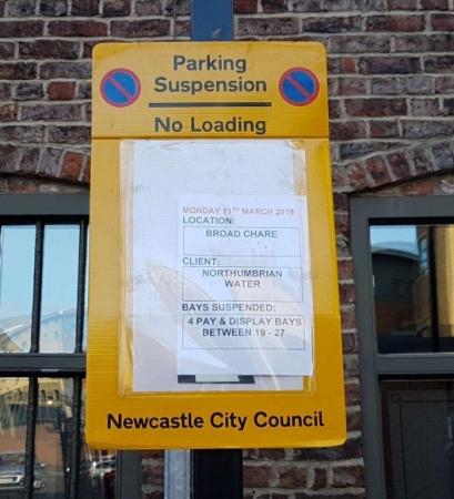 Parking suspension sign, large yellow sign within no waiting symbols and ‘Paking Suspension no loading’ this will then be followed with details of the suspension