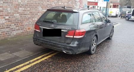 Vehicle parked on double yellow lines in the city centre