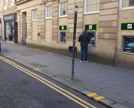 Double yellow lines, with two yellow markings on kerbside along with no loading at any time sign