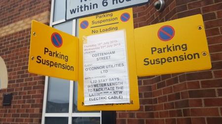 Large Yellow suspension sign which would be displayed adjacent to suspended bays, gives details of suspension. The sign has the no waiting symbol and advises Parking Suspension No loading’