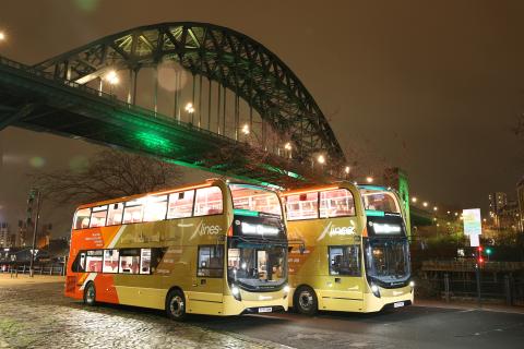 Image showing two double decker buses parked next to Tyne Bridge