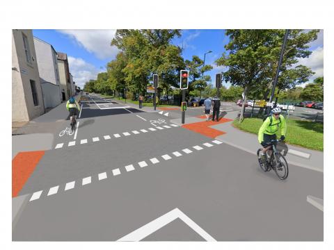 An image of a city street showing how it would  look with new cycle lanes and pedestrian crossing facilities.