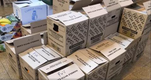 Boxes of food and groceries awaiting delivery by the Grainger Market Delivery Service