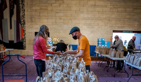 Volunteers preparing packed lunches for delivery at Newcastle Civic Centre