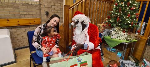 Woman and child meeting santa