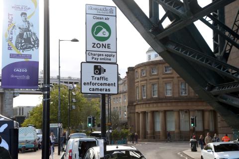 Photo showing a Clean Air Zone road sign underneath the Tyne Bridge on Newcastle Quayside