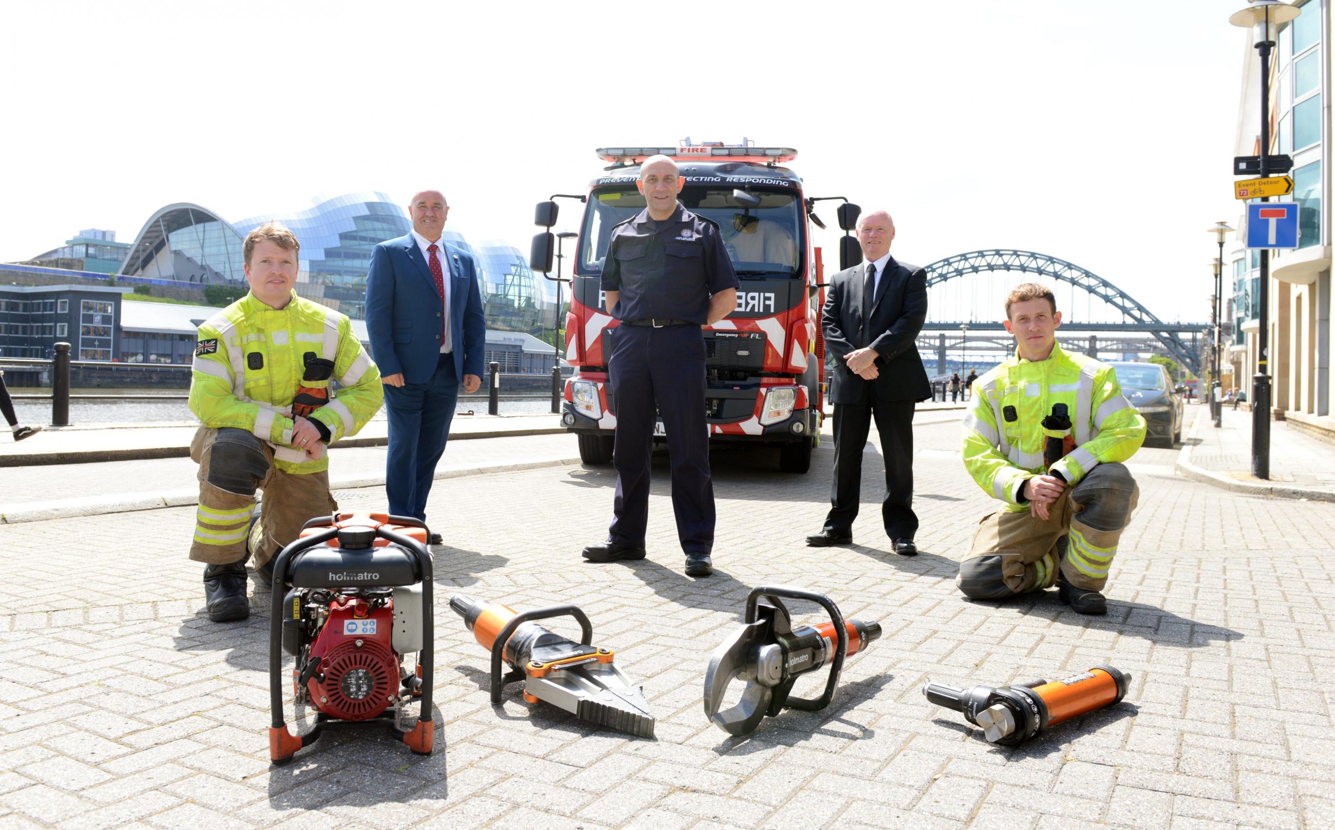 Councillor Ged Bell of Newcastle City Council; DCFO Peter Heath of TWFRS; and Gateshead Councillor Kevin Dodds, a member of the Tyne and Wear Fire and Rescue Authority; with TWFRS firefighters Philip Johnson & Scott Elliott on the Newcastle Quayside