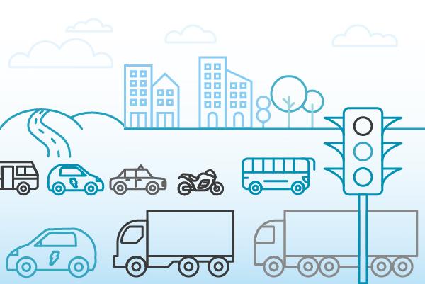A graphic shows two lines of vehicles including lorries, cars ,buses and vans with buildings and trees in the background and a set of traffic lights at the front and right of the image.