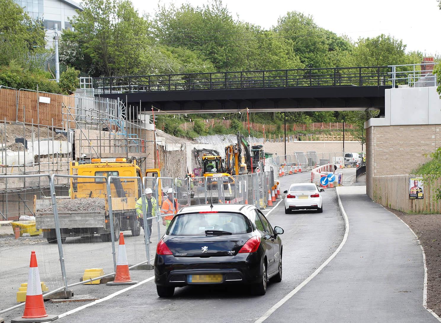 Photo showing cars driving past roadworks on Killingworth Road
